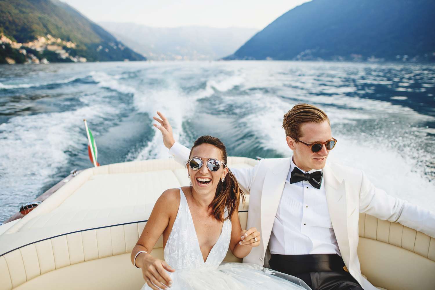 bride and groom riding on boat