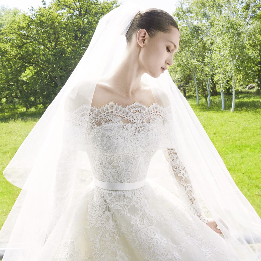 bride wearing Elie Saab off the shoulder lace wedding dress with veil