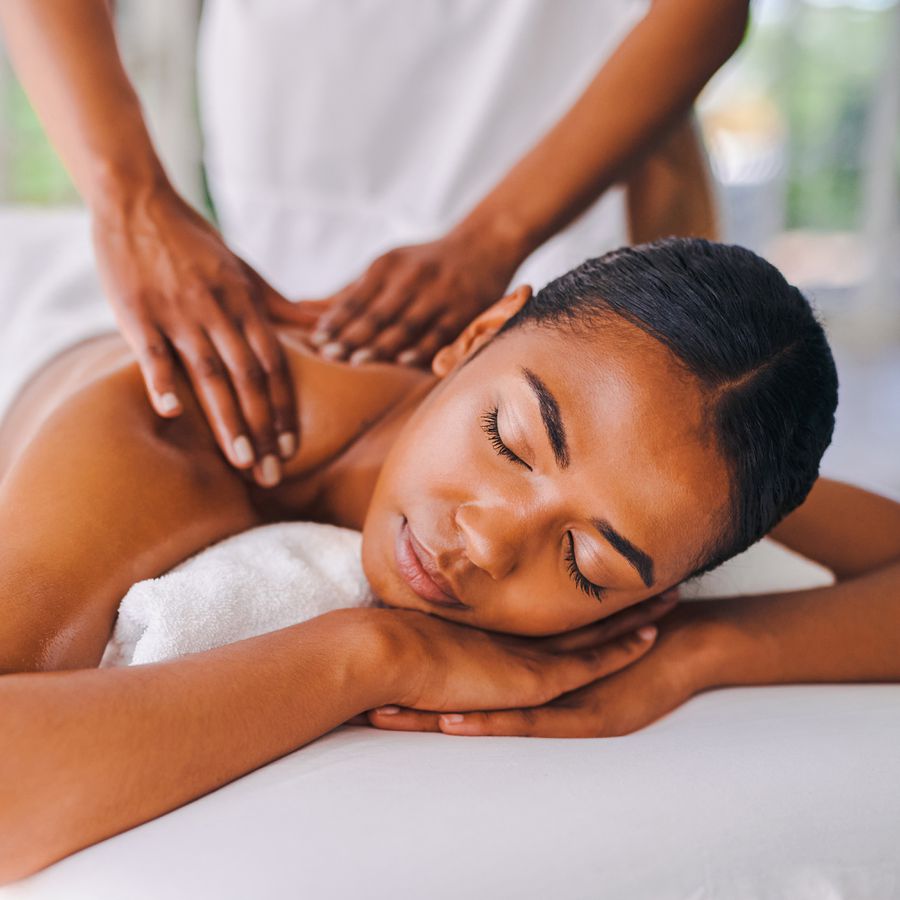 young woman getting a massage at a spa